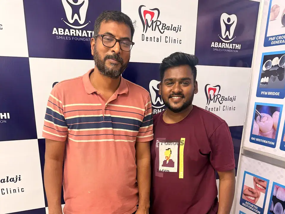 Jayakumar with Dr. Balaji after root canal treatment and crown at M R Balaji Dental Clinic