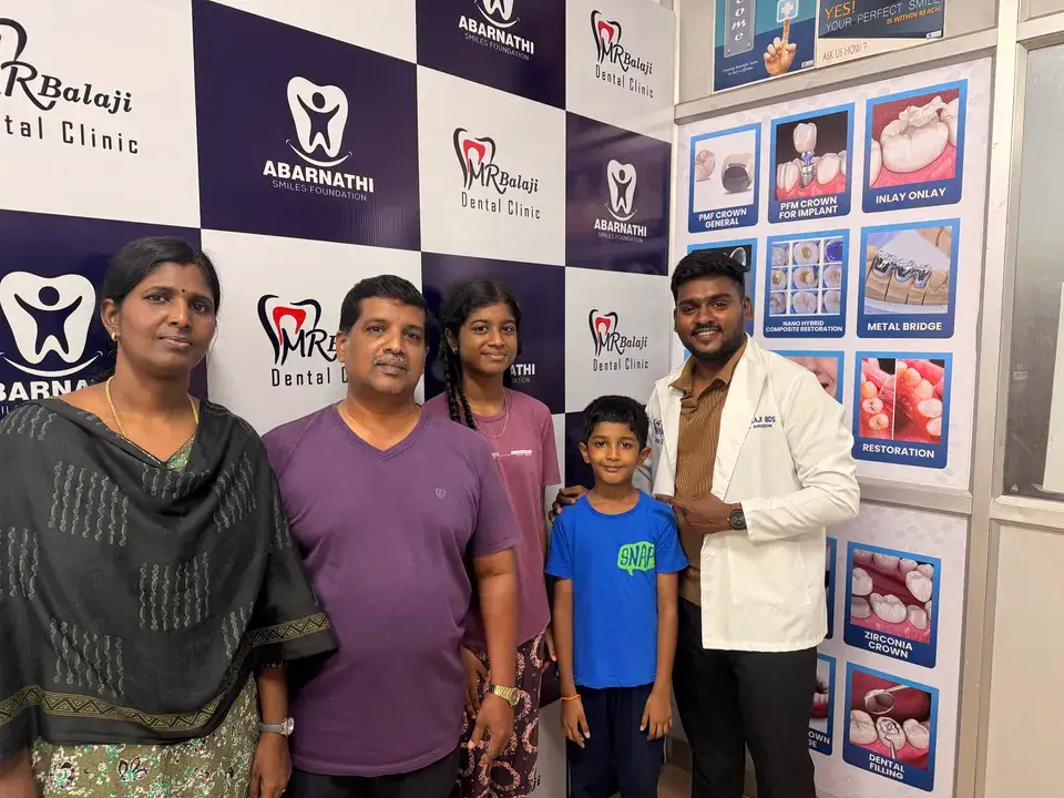 Gopalakrishnan and family with Dr. Balaji at M R Balaji Dental Clinic